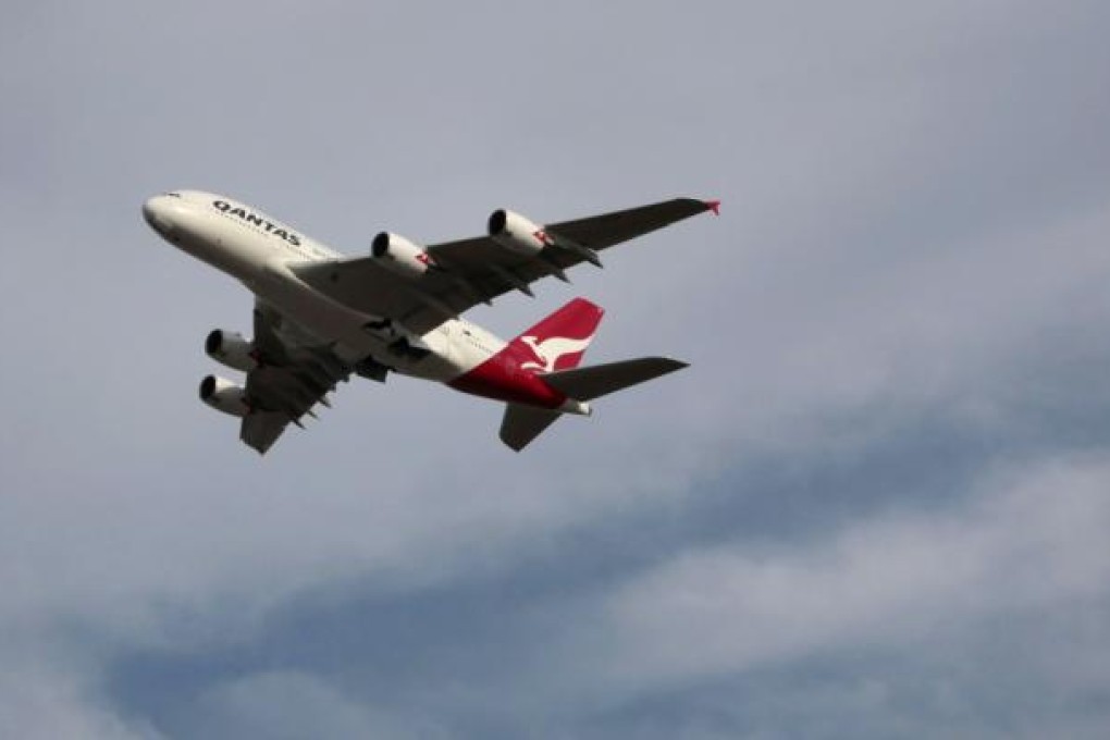 A Qantas A380 takes off from Sydney airport. AIG has moved a step closer to refocusing on its core insurance business with a deal selling up to 90 per cent of its ILFC aircraft leasing business to a Chinese consortium. Photo: Bloomberg