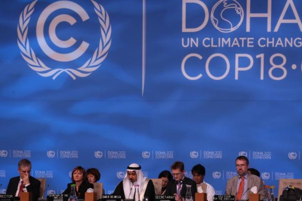 Delegates attend the UN climate talks in Doha. Photo: AFP