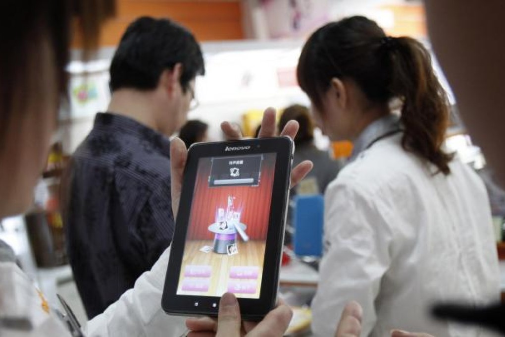 Lenovo is expected to narrow the gap with Apple in total smart connected device shipments over the coming years. Photo: MCT