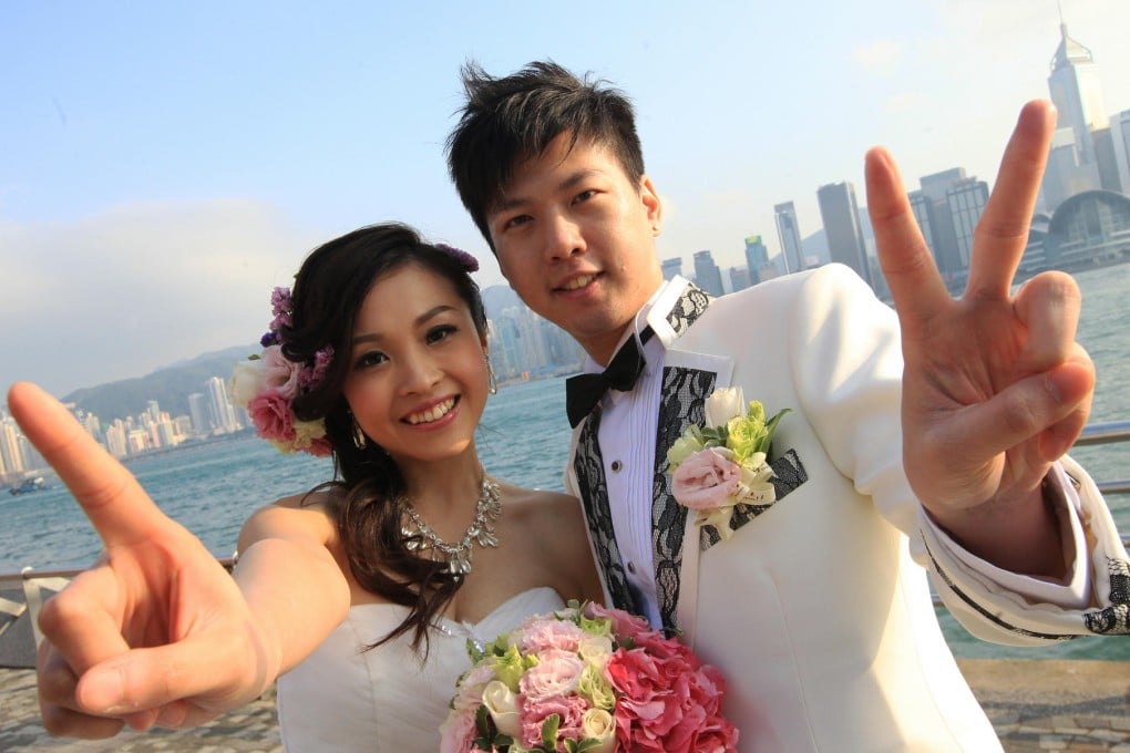 Leung Wing-sum and Chong Tak-kwong celebrate their wedding at Tsim Sha Tsui Marriage Registry. Photo: David Wong