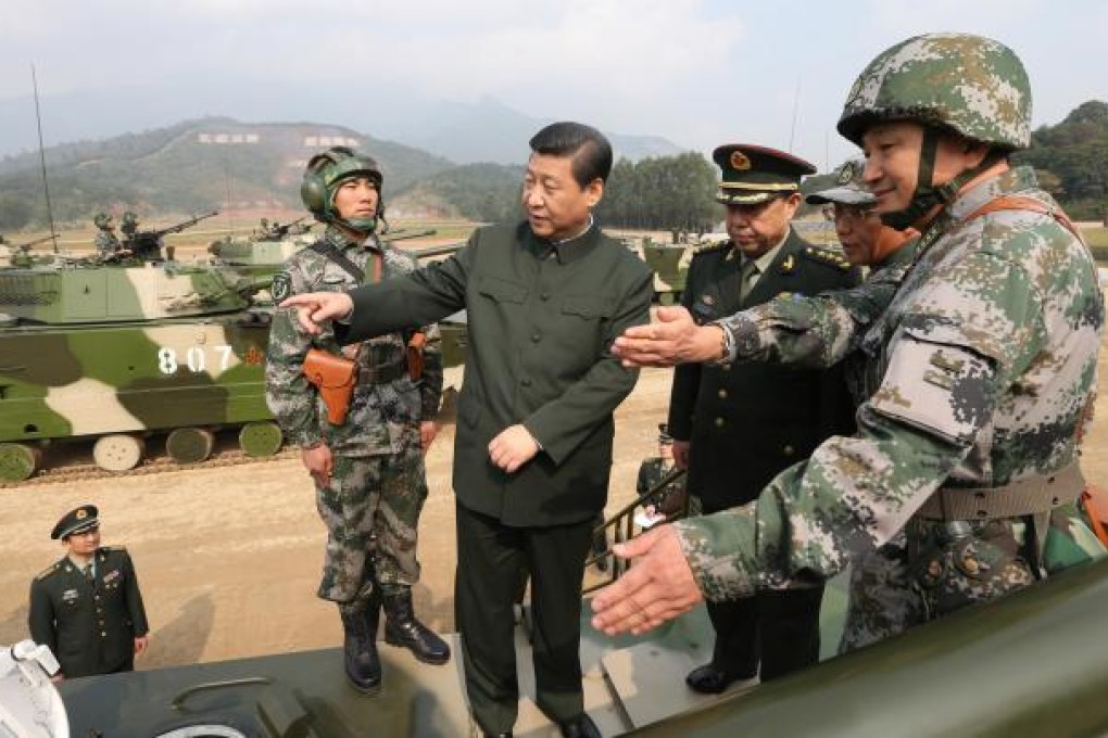 Xi Jinping examines a vehicle in Guangzhou. Photo: Xinhua