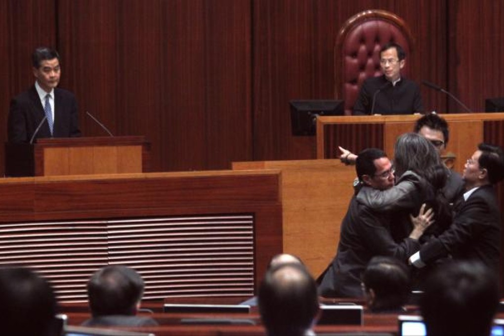 Chief Executive Leung Chun-ying attends a question and answer session regarding the illegal structures at his home in Legislative Council. Photo: Dickson Lee
