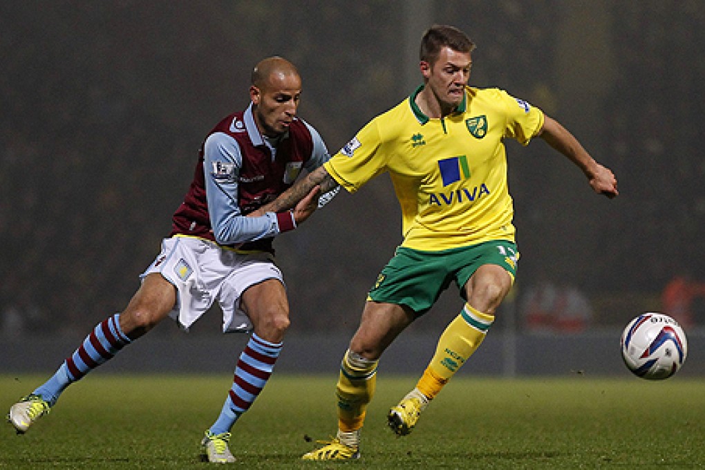 Aston Villa's Karim El Ahmadi (left) vies with Norwich City's Anthony Pilkington on Tuesday. Photo: AFP