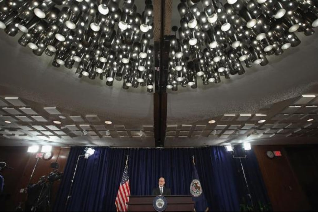 Federal Reserve chairman Ben Bernanke announces the central bank's fiscal commitment to improving the labour market. Photo: AFP