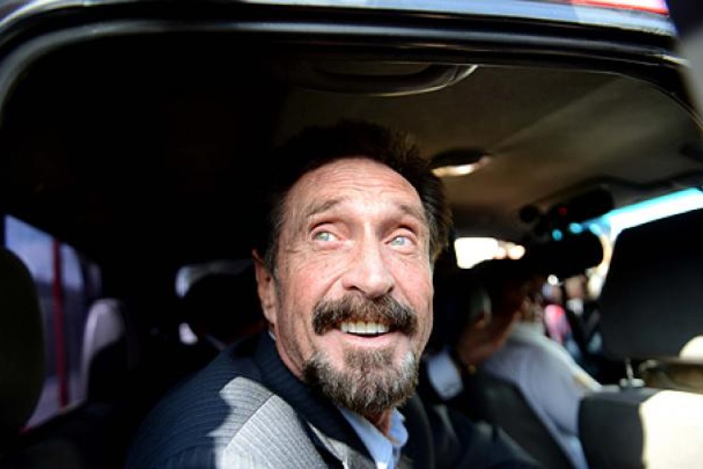 John McAfee arrives at the airport in Guatemala City bound for Miami. Photo: AFP