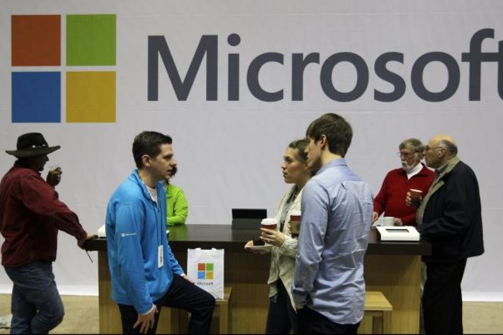 Microsoft employees and guests mingle at a pop-up Microsoft Store. The software giant has angered trade groups and advertisers because it says it will not change an automatic setting in its newest version of Internet Explorer that tells websites not to track user behaviour. Photo: AP