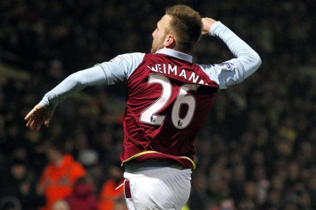 Andreas Weimann celebrates one of his two goals. Photo: AFP
