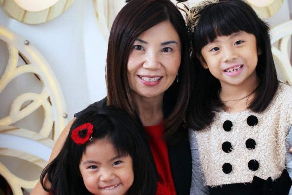 Esther Ma with daughters, Tiqa Lee (in red) and Quisha Lee.Photo: Felix Wong
