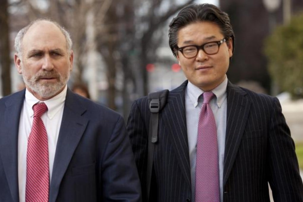 Bill Hwang, founder of Tiger Asia Management, leaves court with his attorney Lawrence Lustberg in New Jersey. Photo: Bloomberg