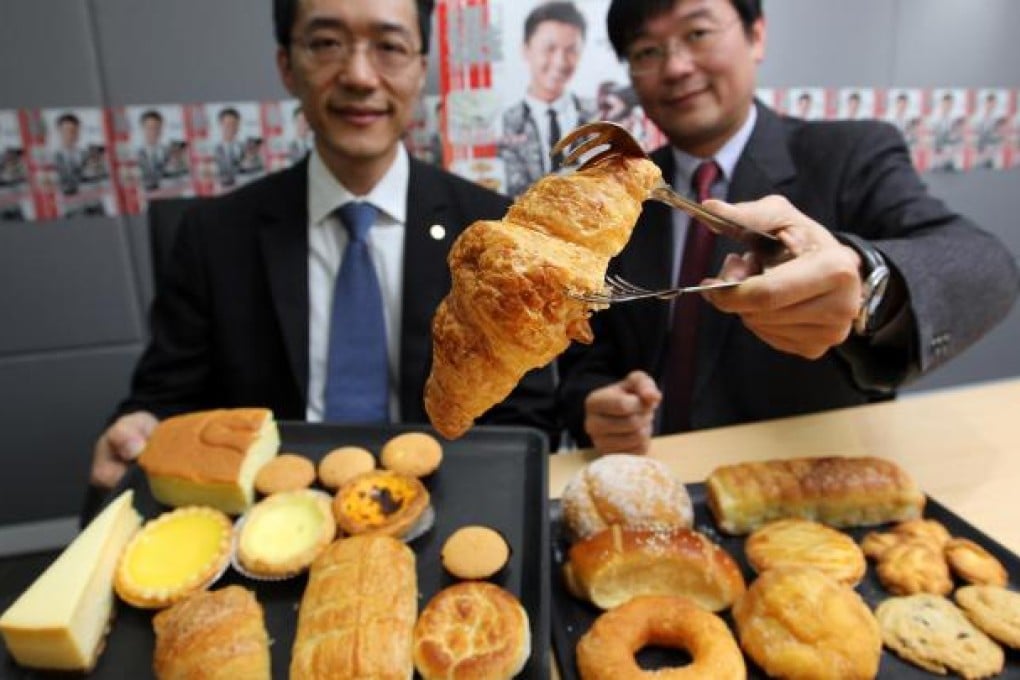 The Food Safety Centre's Samuel Yeung and the Consumer Council's Ron Hui with some of the worst-offending pastries. Photo: Nora Tam