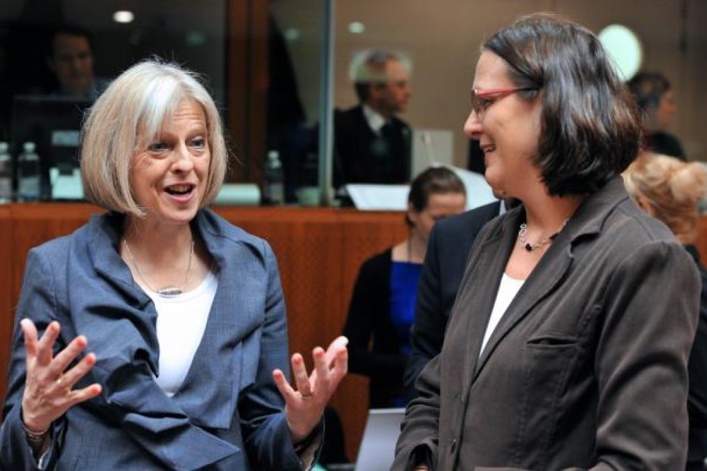 British Secretary of State for Home Department Theresa May (left). Photo: AFP