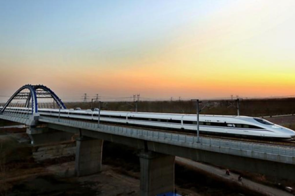 A high-speed train runs over the Yellow River Railway Bridge in Zhengzhou City, Henan, last month. The run was part of a trial operation of the Beijing to Guangzhou rail route that will open on December 16. Photo: Xinhua