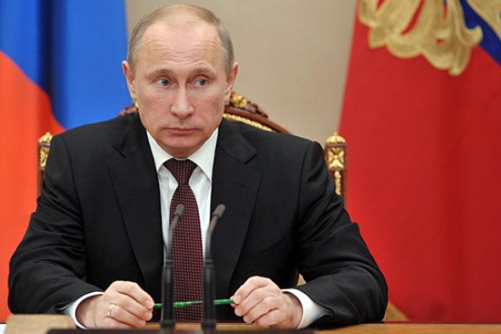 Russian President Vladimir Putin chairs a Security Council meeting on Syria in Moscow on Friday. Photo: AP