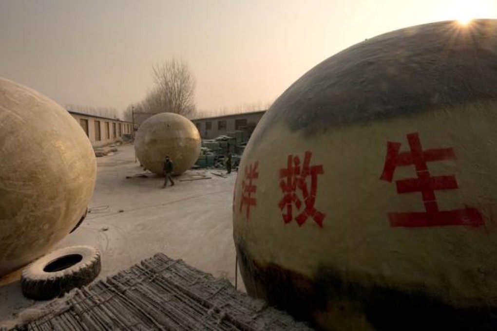 Survival pods made by farmer Liu Qiyuana are airtight spheres with varying interiors contain oxygen tanks and seatbelts with space for around 14 people, and are designed to remain upright when in water. Photo: AFP