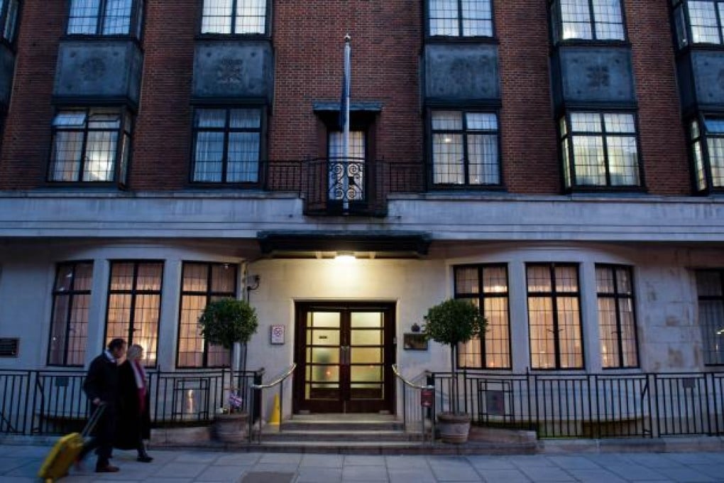 Pedestrians walk past the door of the King Edward VII hospital in central London. Photo: AFP