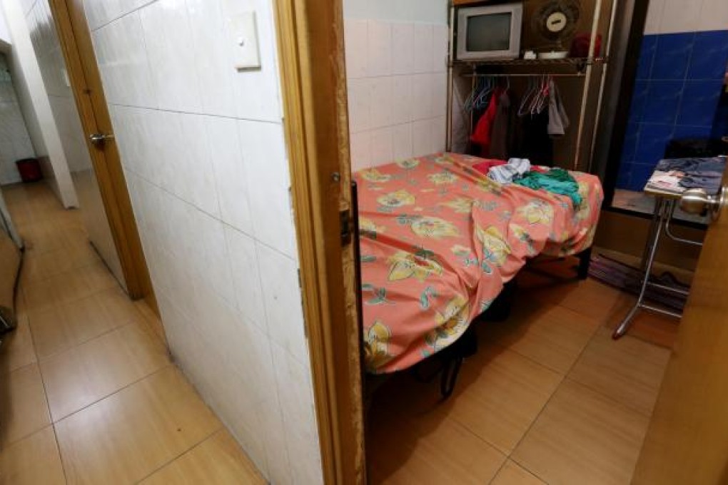 A subdivided flat in Sham Shui Po. Officials have no real idea how many families live in such accommodation. Photo: David Wong