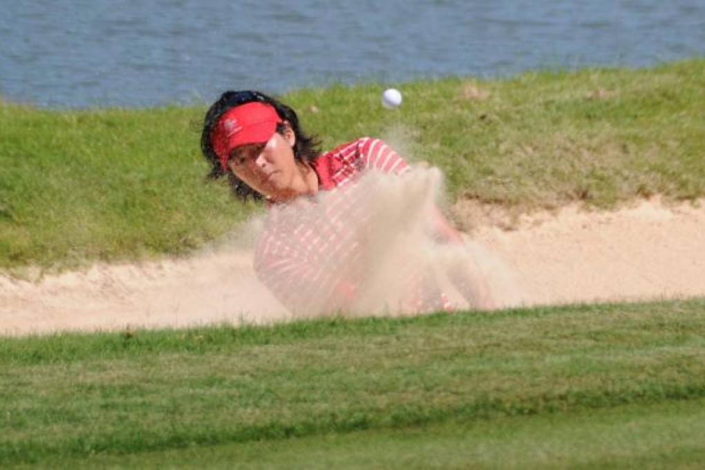Japan's Ryo Ishikawa, representing Asia, blasts out of a bunker during his Royal Trophy contest against Swede Henrik Stenson. Photo: Xinhua