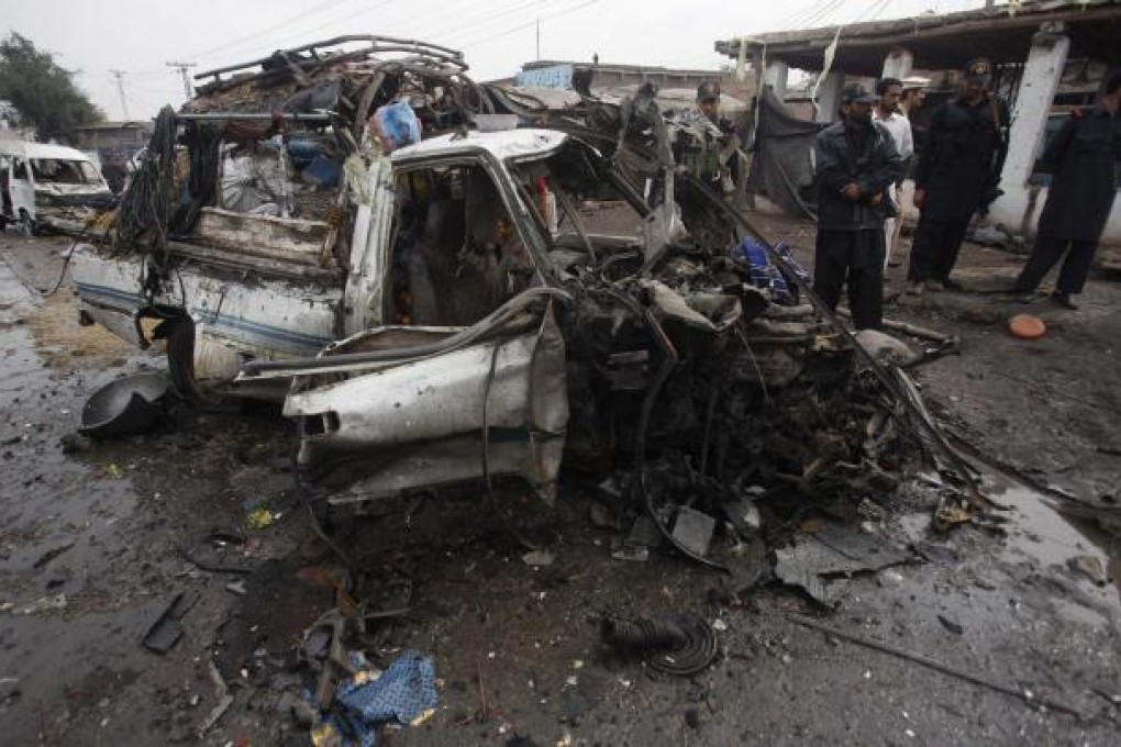 A car destroyed in the attack in the Khyber region. Photo: Reuters