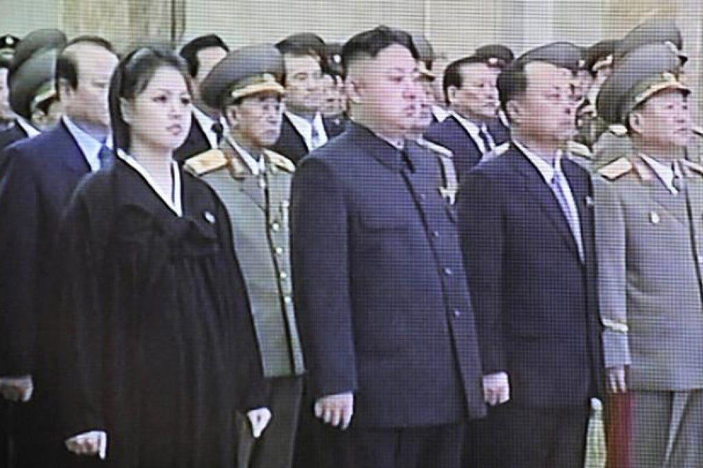 North Korean leader Kim Jong-un and his wife Ri Sol-ju attend a memorial ceremony to mark the first anniversary of the death of Kim Jong-il. Photo: AFP