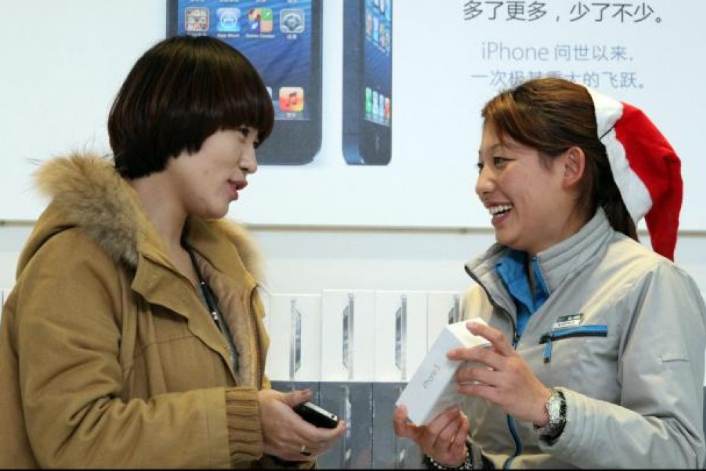 Apple says more than two million iPhone 5 smartphones were bought on the mainland in the product's first weekend on sale. Photo: Xinhua