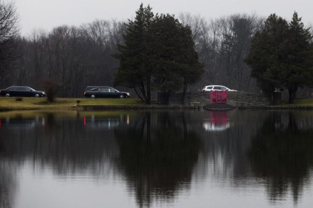 The funeral procession taking the coffin of school shooting victim Jack Pinto, six, to Newtown Village Cemetery. Photo: New York Times