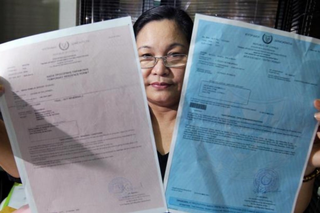 Milagros Ipp, of Limestone Overseas and Trading, at her office in North Point with some of the documents. Photo: May Tse