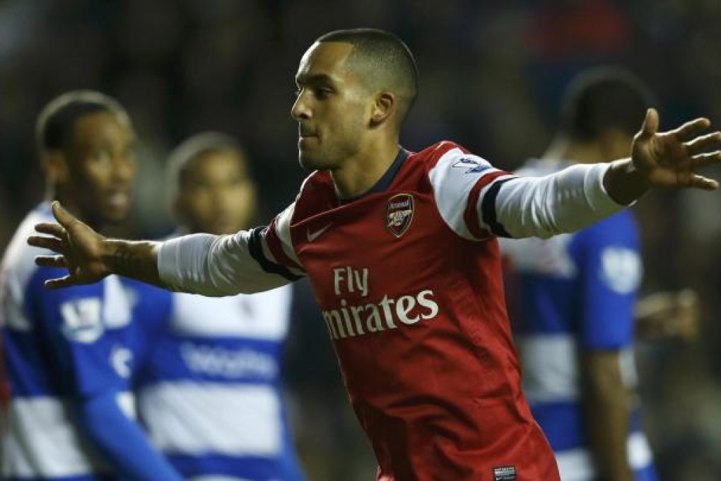 Arsenal's Theo Walcott celebrates after scoring against Reading during their English Premier League match at Reading's Madejski stadium. Photo: Reuters