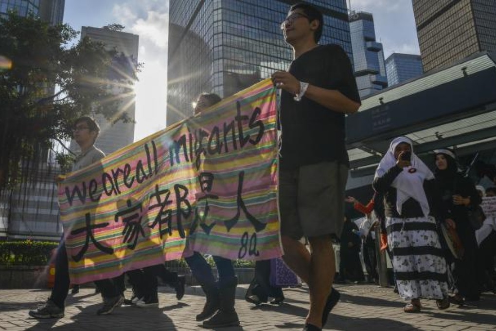 About a thousand migrant domestic workers from Southeast Asia rallied in Hong Kong to mark International Migrants Day and push for better working conditions and higher wages. Photo: AFP