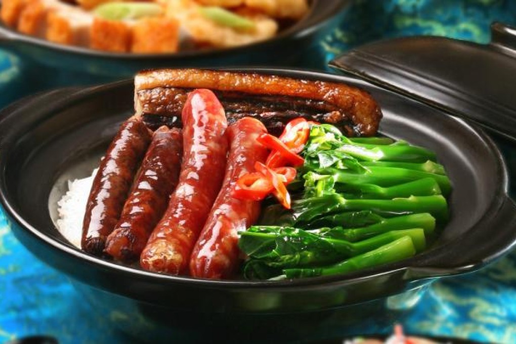 Rice with assorted preserved meats in clay pot.