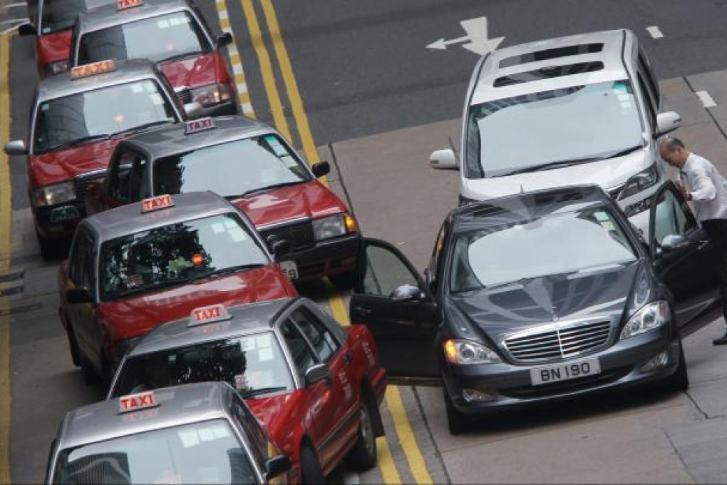 Cars illegally double-parked in Central. Photo: David Wong