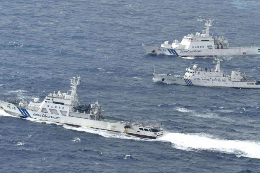 Chinese marine surveillance cruises next to Japan Coast Guard patrol ships in the East China Sea, known as Diaoyu islands or Senkaku isles. Photo: Reuters