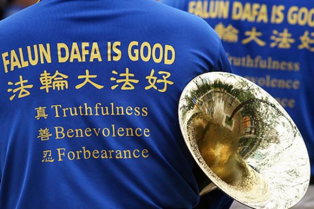 A man takes part in the Falun Gong 10th Anniversary anti-prosecution rally in Hong Kong. Photo: Jonathan Wong