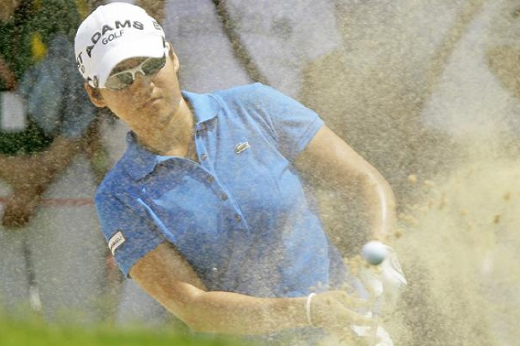 Yani Tseng of Taiwan hits a shot from a bunker of the 1st hole during the third round of LPGA Thailand golf tournament in Pattaya in 2011. Photo: AP