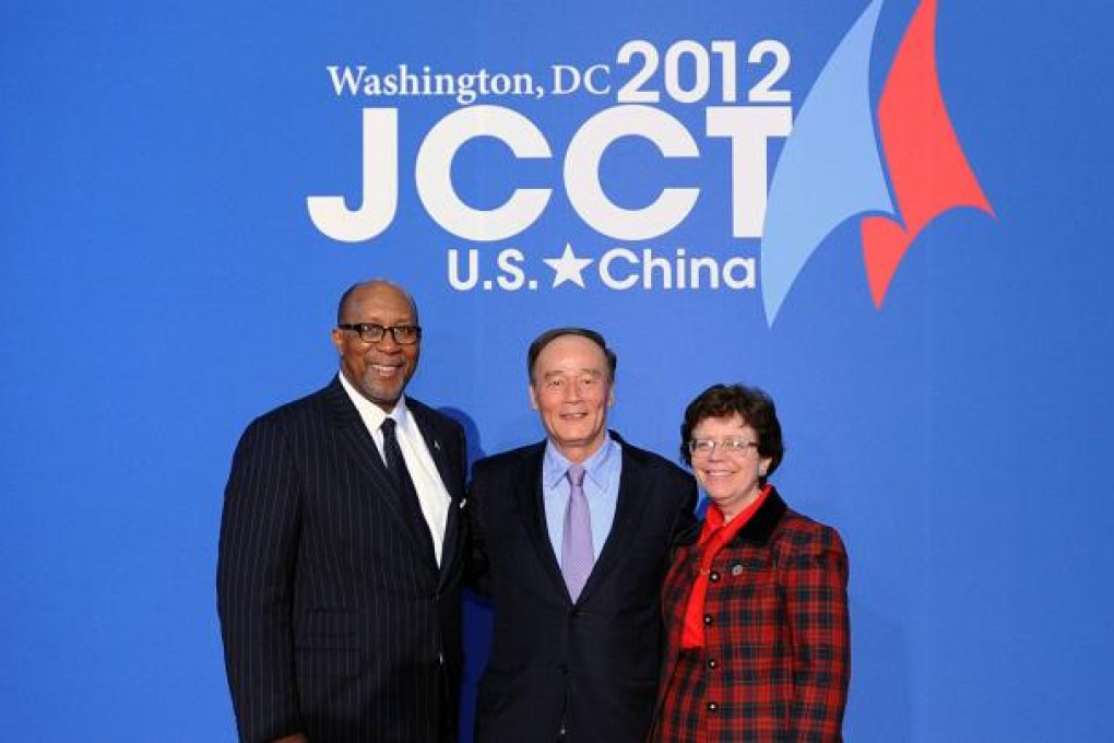 Chinese Vice-Premier Wang Qishan (centre).
