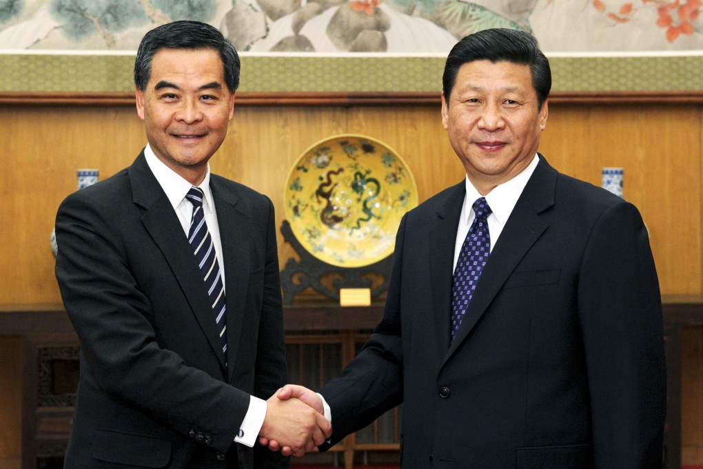 Chief Executive Leung Chun-ying and party leader Xi Jinping shake hands before their meeting in Beijing yesterday. Photo: Xinhua
