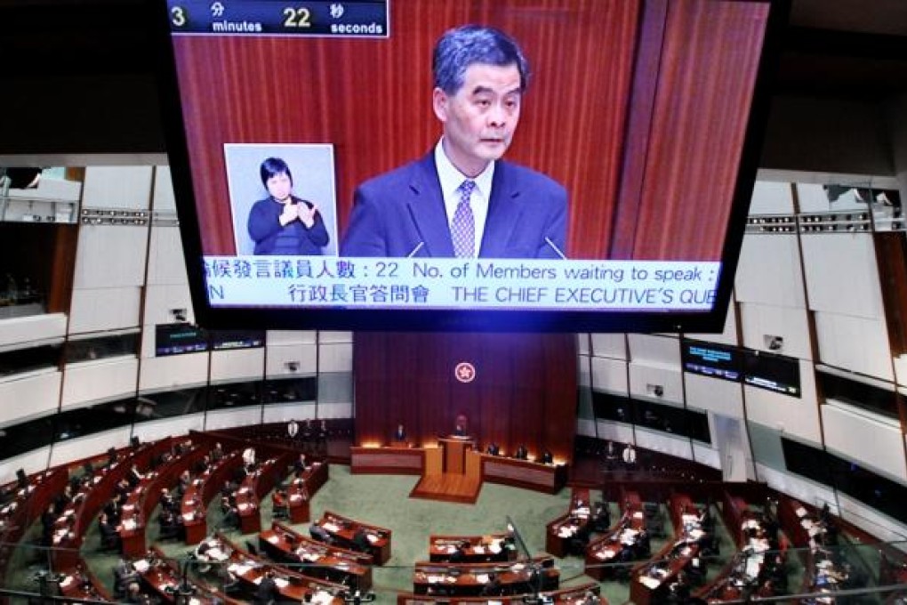 Chief Executive Leung Chun-ying attends a question and answer session regarding the illegal structures at his home in Legislative Council. Photo: Sam Tsang