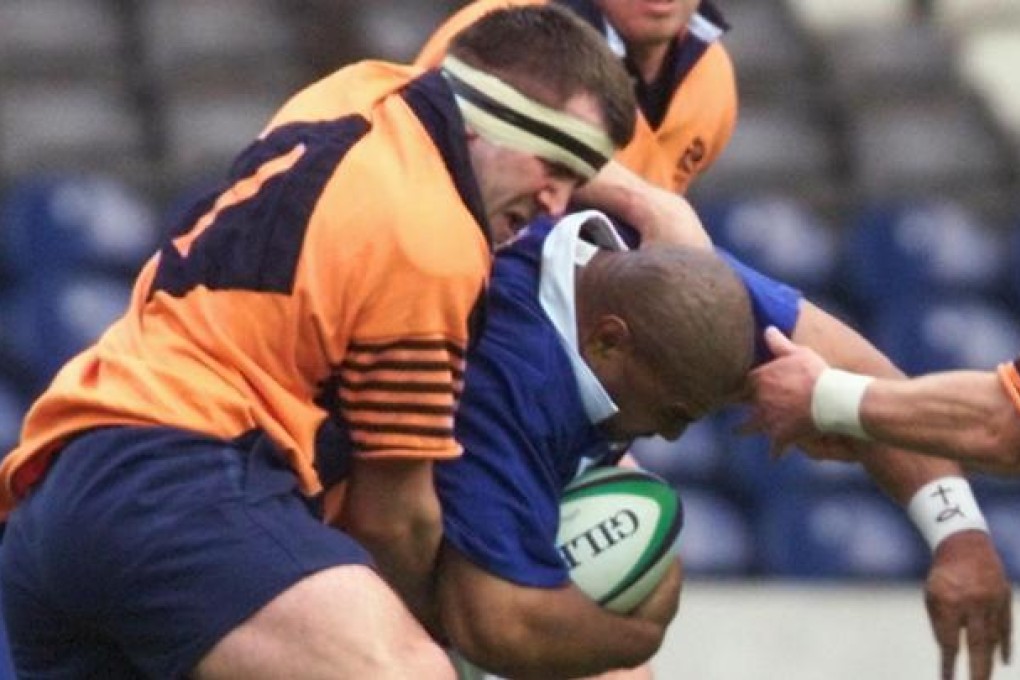 Former Scottish rugby international Tom Smith (in orange) speaks openly about his epilepsy. Photo: AFP