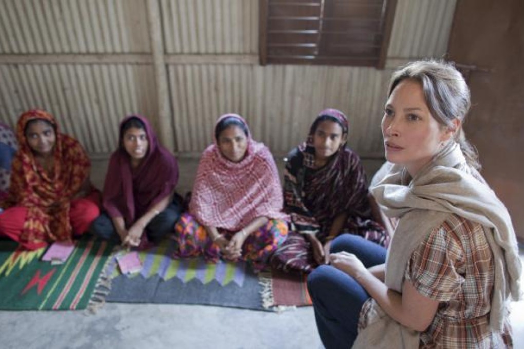 Every Mother Counts founder, Christy Turlington Burns (far right), visits village women in Bangladesh. Photo: CARE