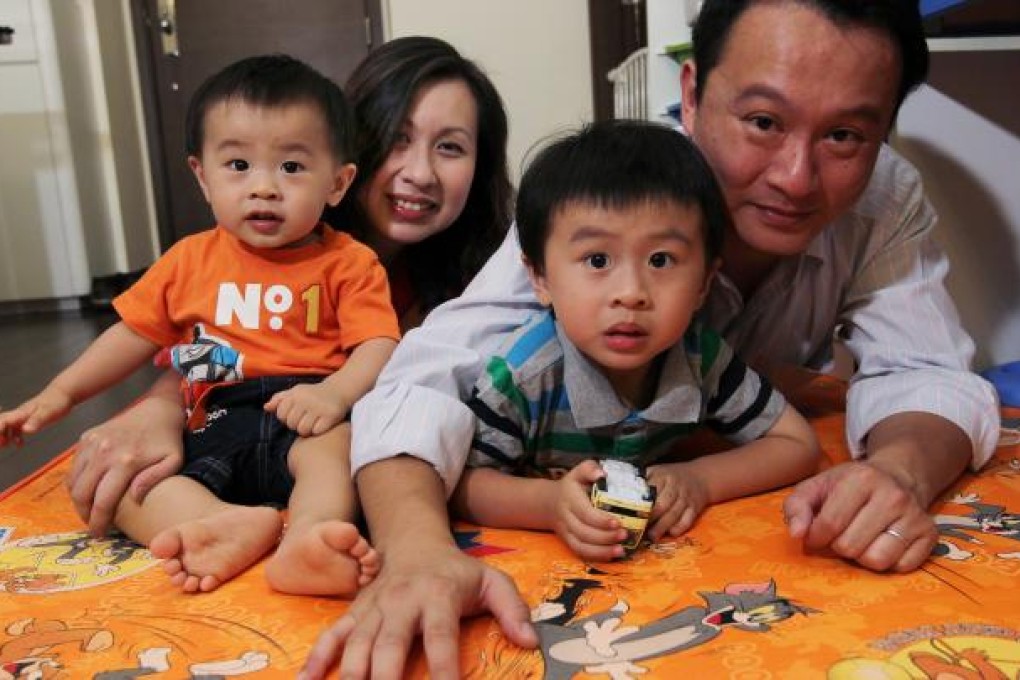 Father Ivan Wong Chin (right) was able to enjoy paternity leave thanks to new company policy. Photo: Edmond So