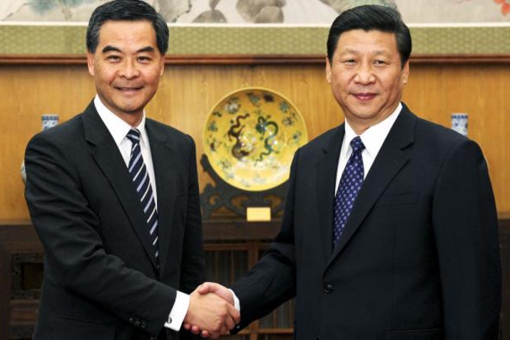 Chief Executive Leung Chun-ying and party leader Xi Jinping shake hands before their meeting in Beijing. Photo: Xinhua