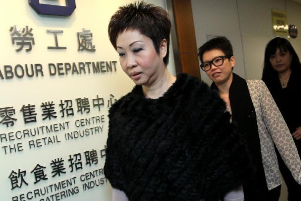 Dora Lai Yuk-sim (left), chairman of the Cathay Pacific Flight Attendants' Union, appears at Labour Department office in Wan Chai to negotiate with the airline. Photo: Sam Tsang