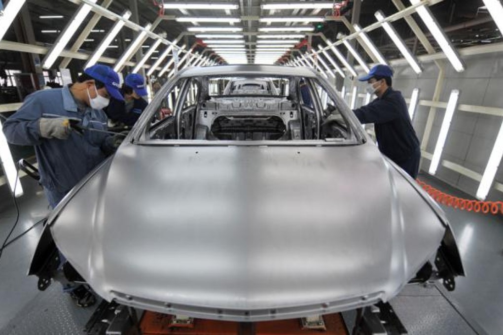 Workers on the assembly line in Geely Auto's Ningbo factory. Photo: Xinhua