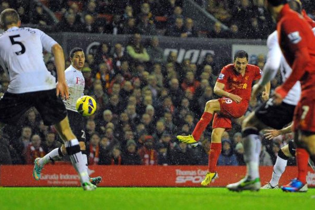 Winger Stewart Downing slams home Liverpool's third goal against Fulham at Anfield. Photo: AFP