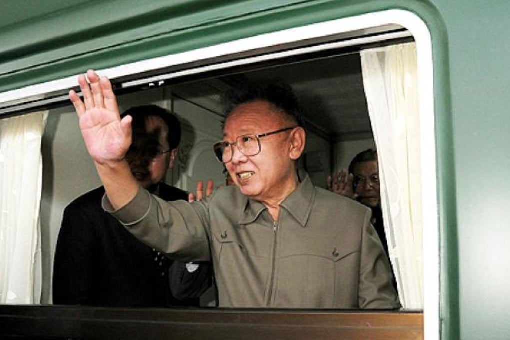 North Korea's Kim Jong-Il waves from a train in Beijing in May 2010. He died aboard a train on December 17, 2011. Photo: AFP
