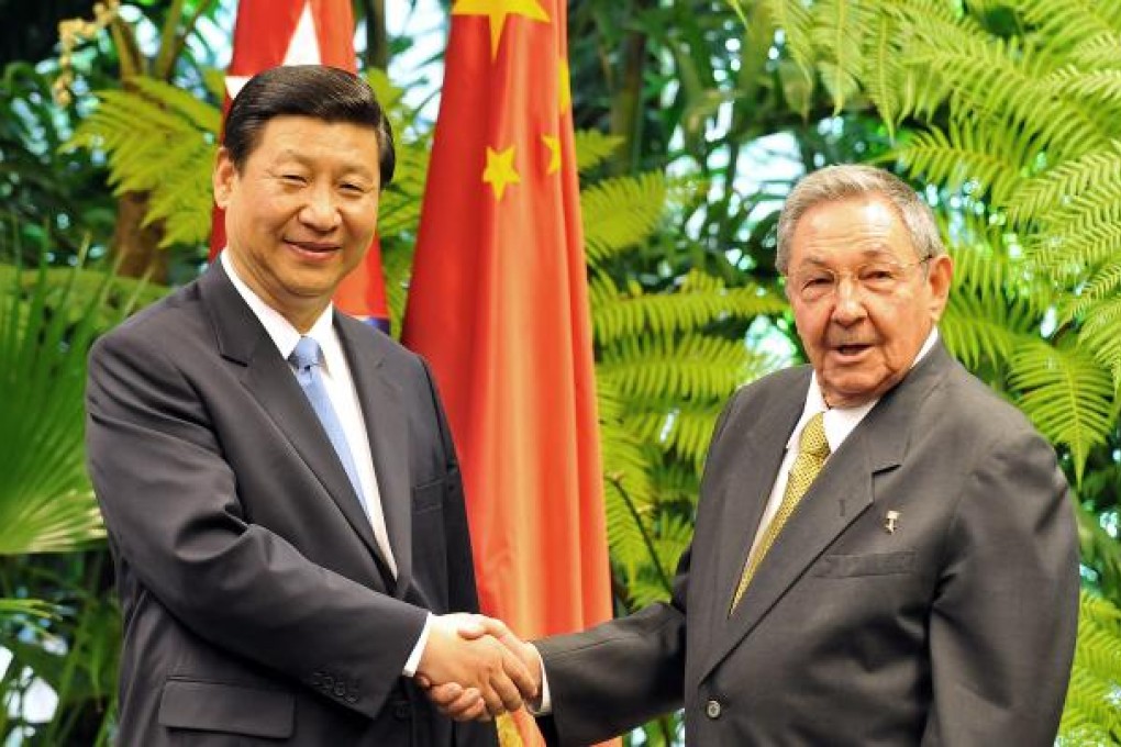 China's Vice-President Xi Jinping (left) shakes hands with Cuban President Raul Castro (right), on June 5, 2011 at Revolution Palace in Havana. Photo: AFP