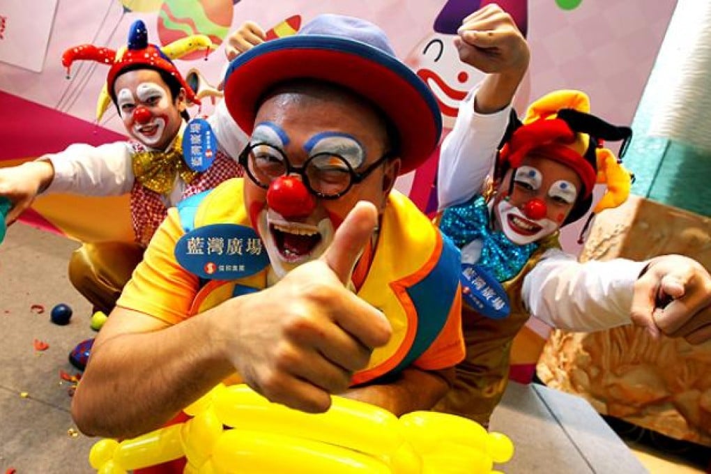 The winner (centre) Tony Leung Kin-wing pose a picture with the School section winner (left) Wong Chun-kiu and (right) Mok Long-hei during the prizes presentation ceremony of the second Hong Kong Clown Festival in Island Resort Mall at Siu Sai Wan. Photo: Felix Wong