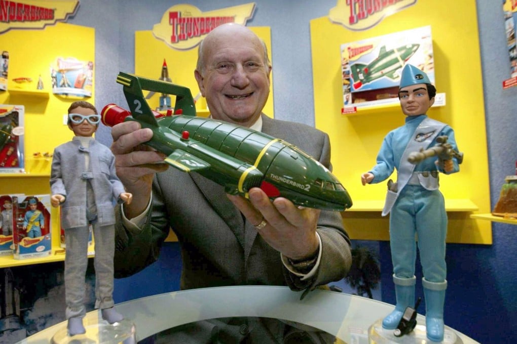 In this January 2005 file photo, Gerry Anderson, poses for a photograph with a toy Thunderbird 2 on the 40th anniversary of the Thunderbirds first broadcast, in London. Photo: AP