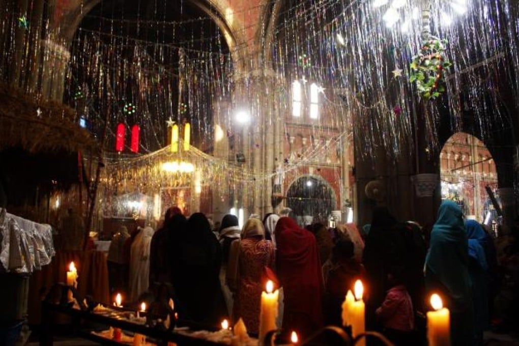 Christians pray during a Christmas mass. Photo: Xinhua