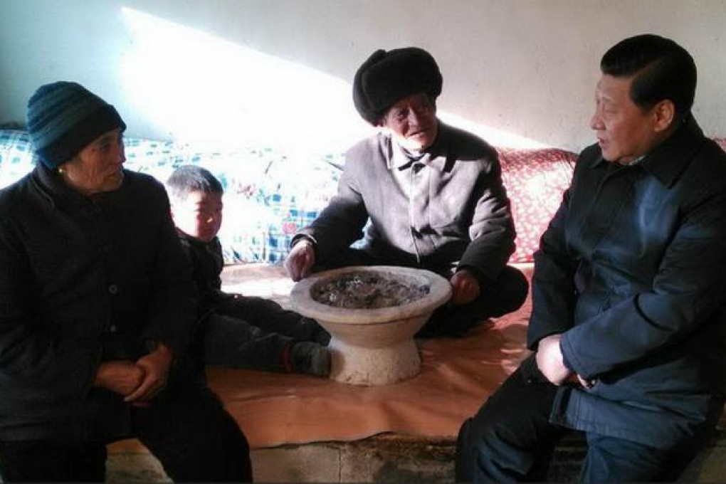 Xi Jinping with villagers during his visit. Photo: SCMP