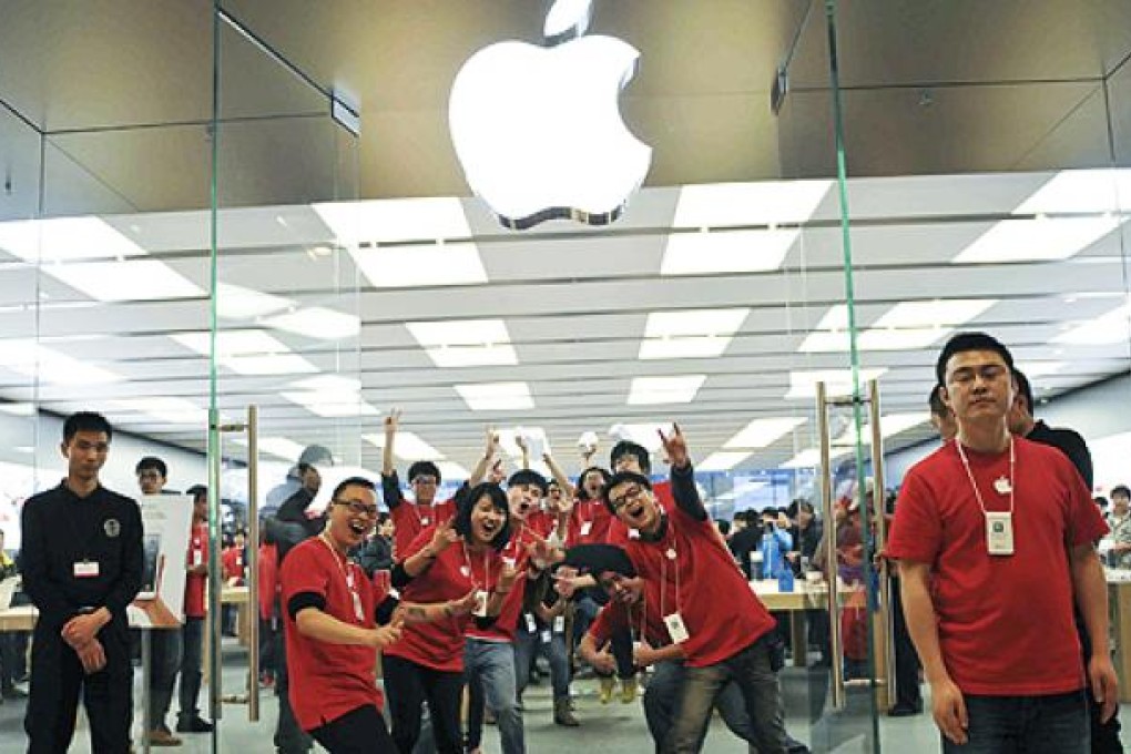 Workers at a new Apple store in Chengdu, in southwest China's Sichuan province. Between one-third to one-half of the iPads sold worldwide are assembled in Chengdu. Photo: AP